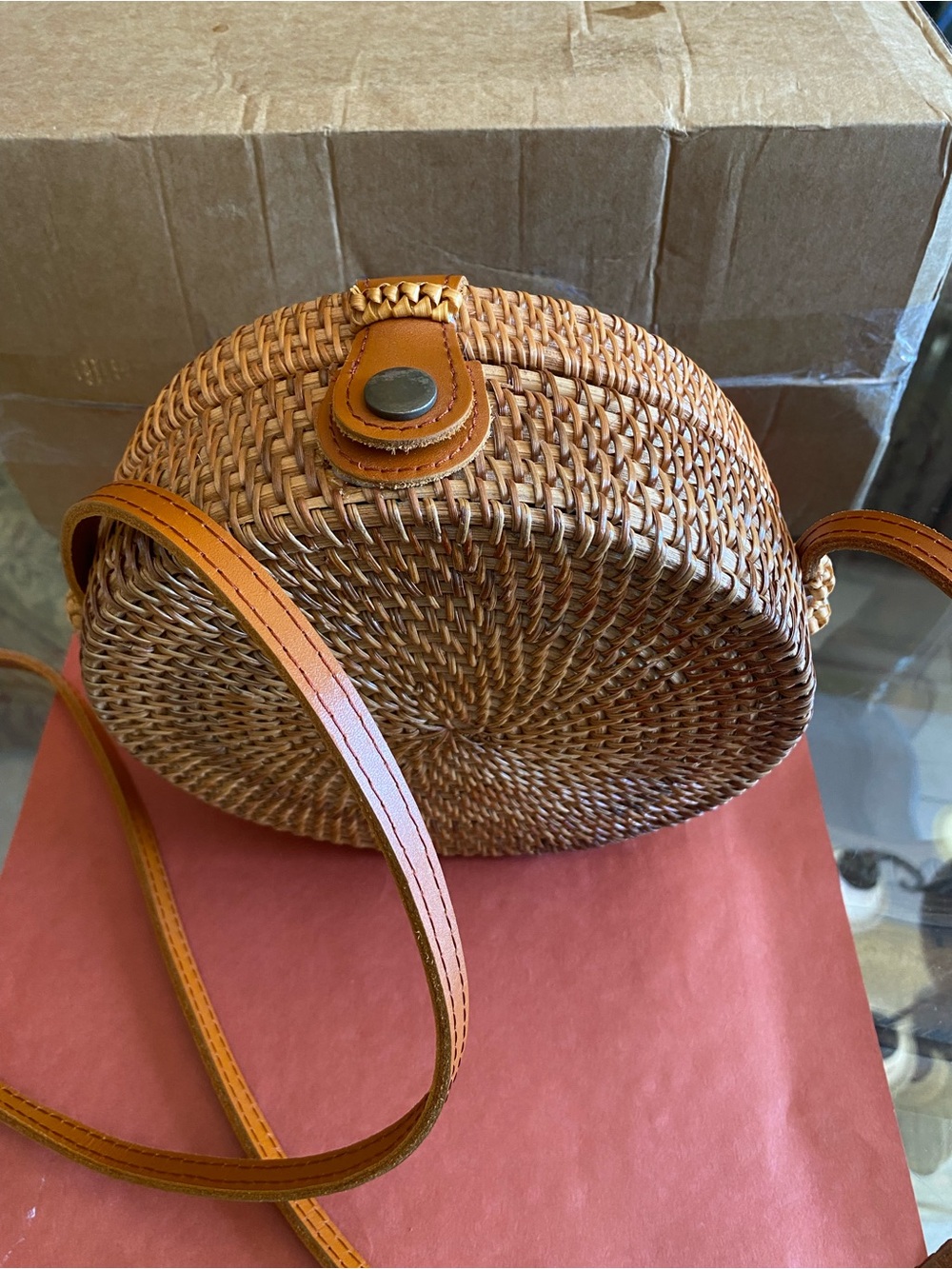 Bali Round Woven Crossbody Bag in Tan and Brown Leather Strap